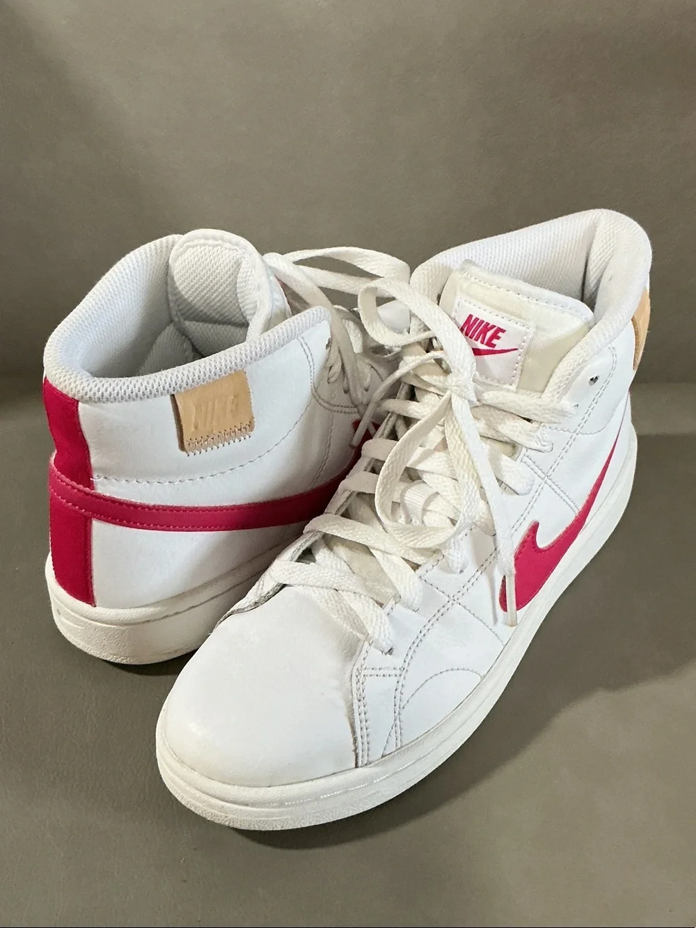 Nike Women's White Sneakers with Pink Swoosh High-Top